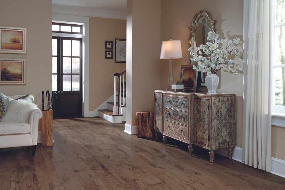 solid hardwood flooring in living room with vintage buffet